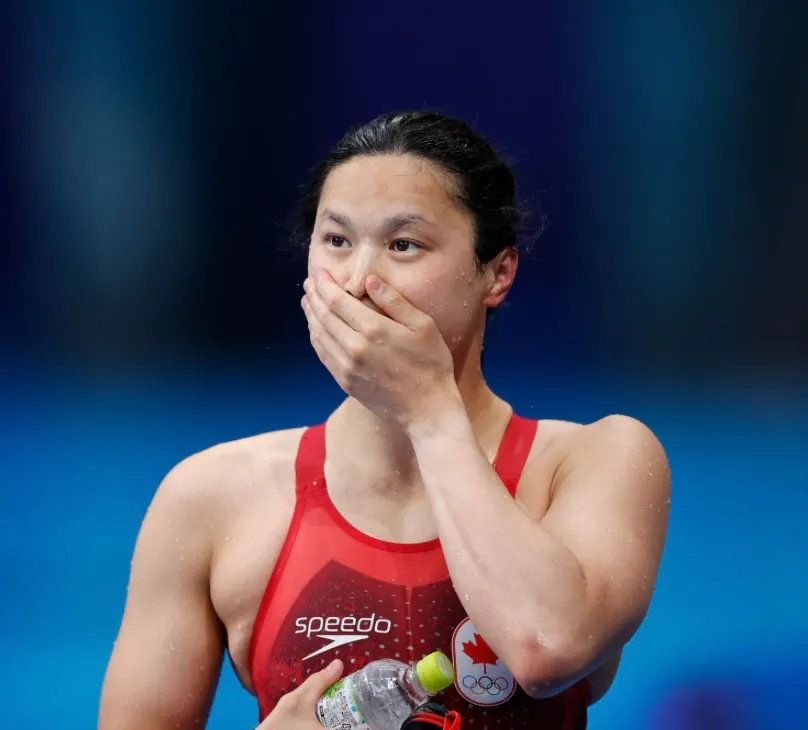Underwater view of competitive swimmer demonstrating proper freestyle technique and body position